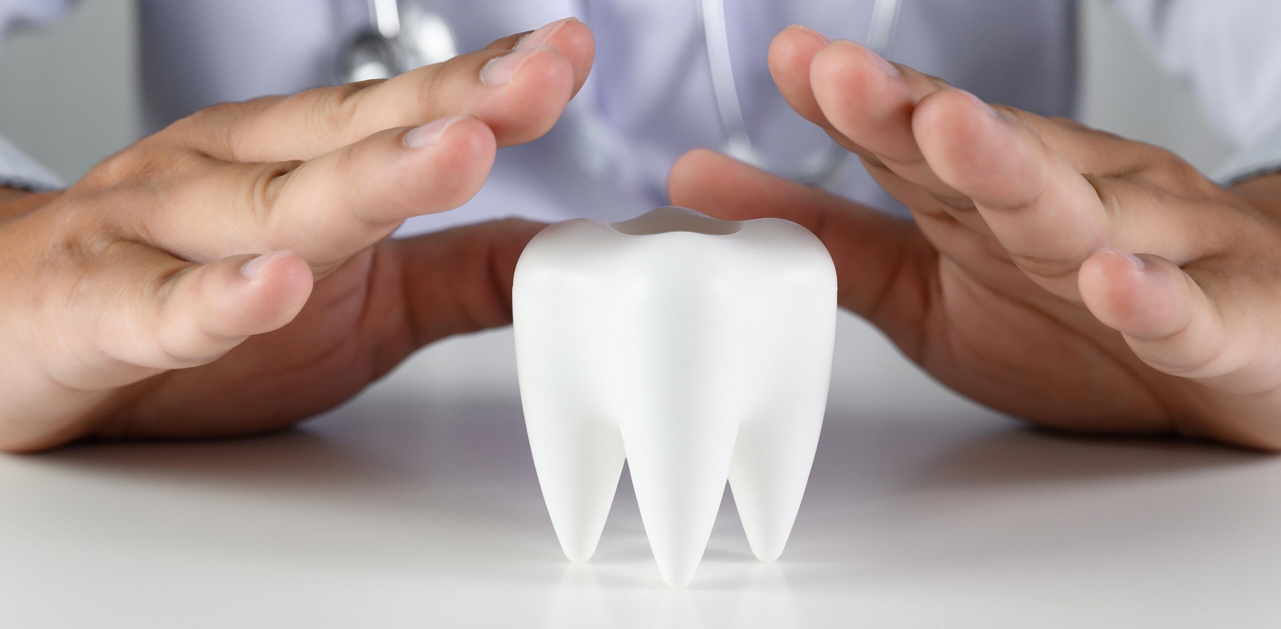 close up man holding hands table